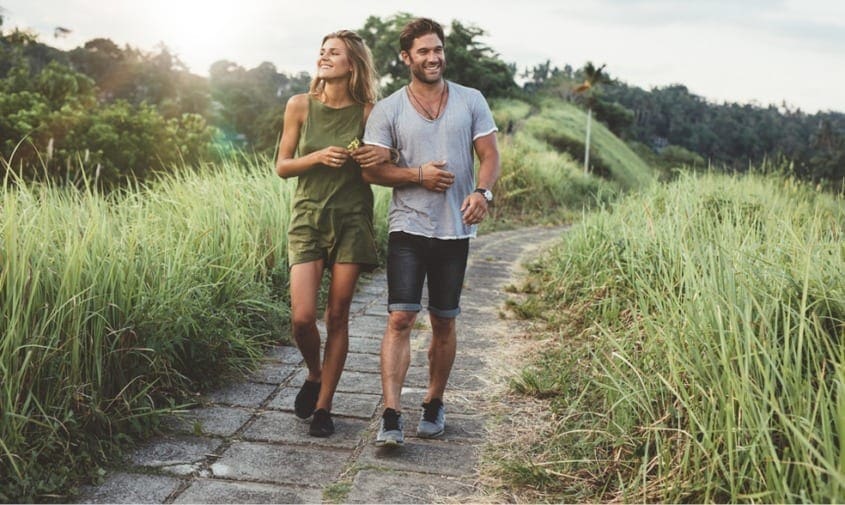 couple walking together on trail