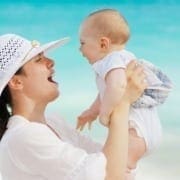 Woman and baby smiling