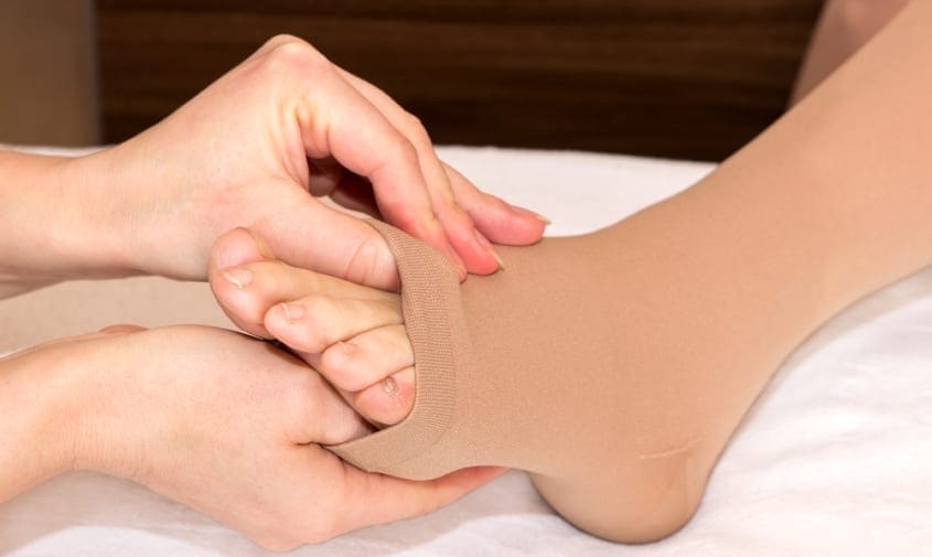 Compression sock on ankle and foot to improve circulation